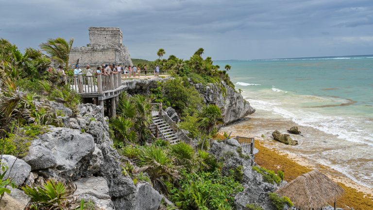 El Castillo, the castle of the ancient Maya city of Tulum, stands on a cliff overlooking the sea.