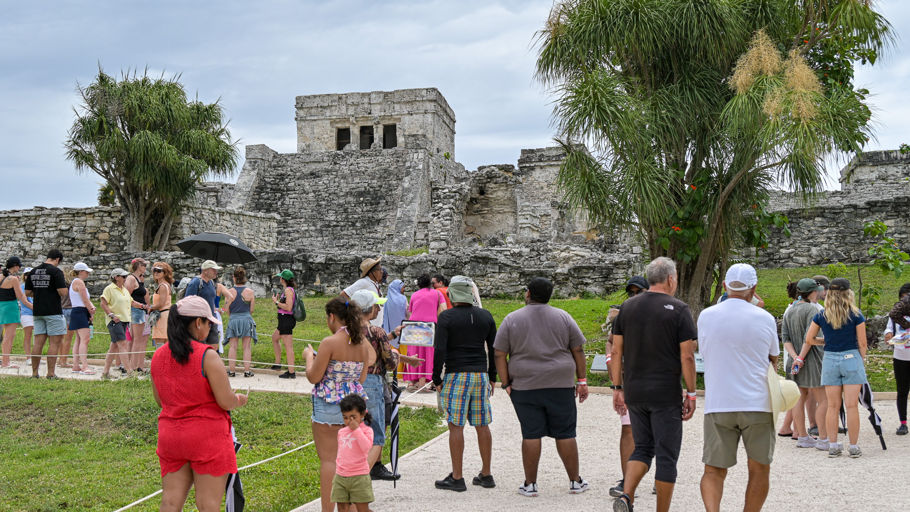 View of “El Castillo” from the countryside. The temple stands on a cliff about twelve meters above sea level