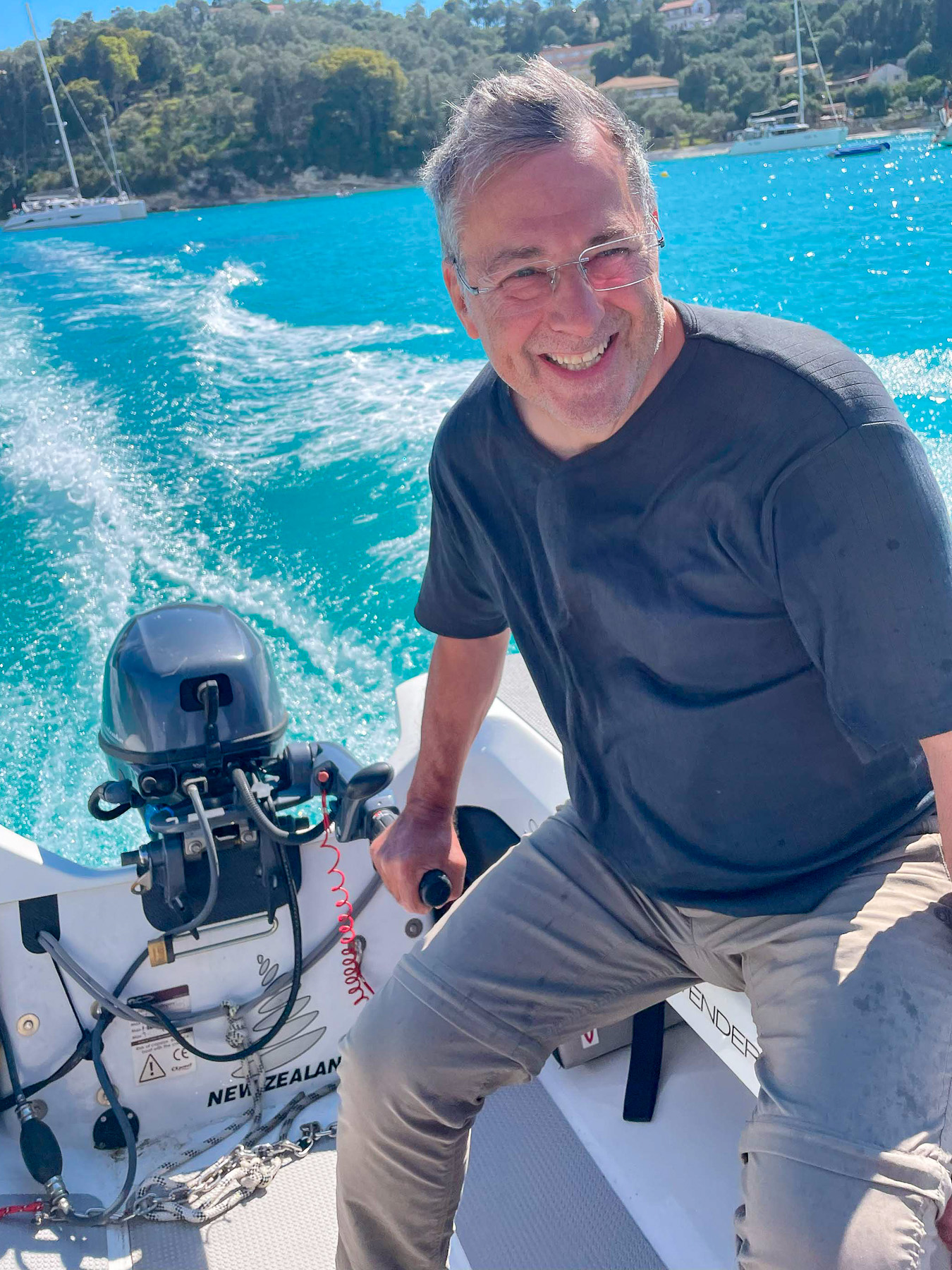 Peter loves gliding quickly across the water in the dinghy.